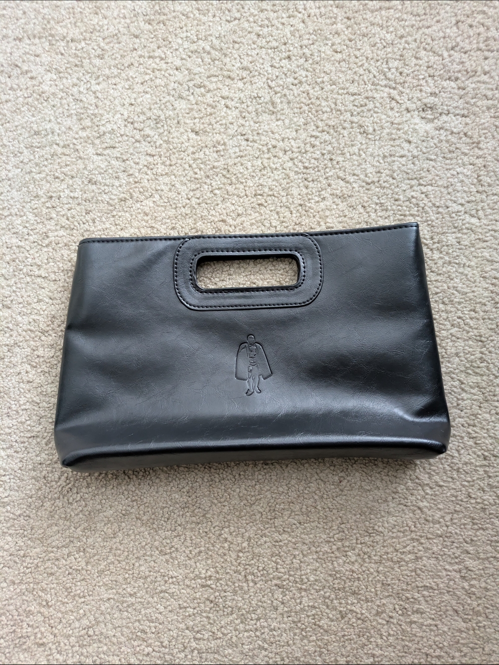 Minimalist Venetian Leather Black Leather Handheld Clutch with Cutout Handle
